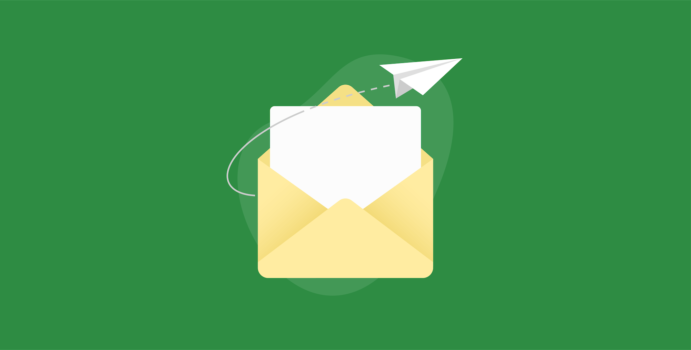 Envelope with paper and paper airplane next to it